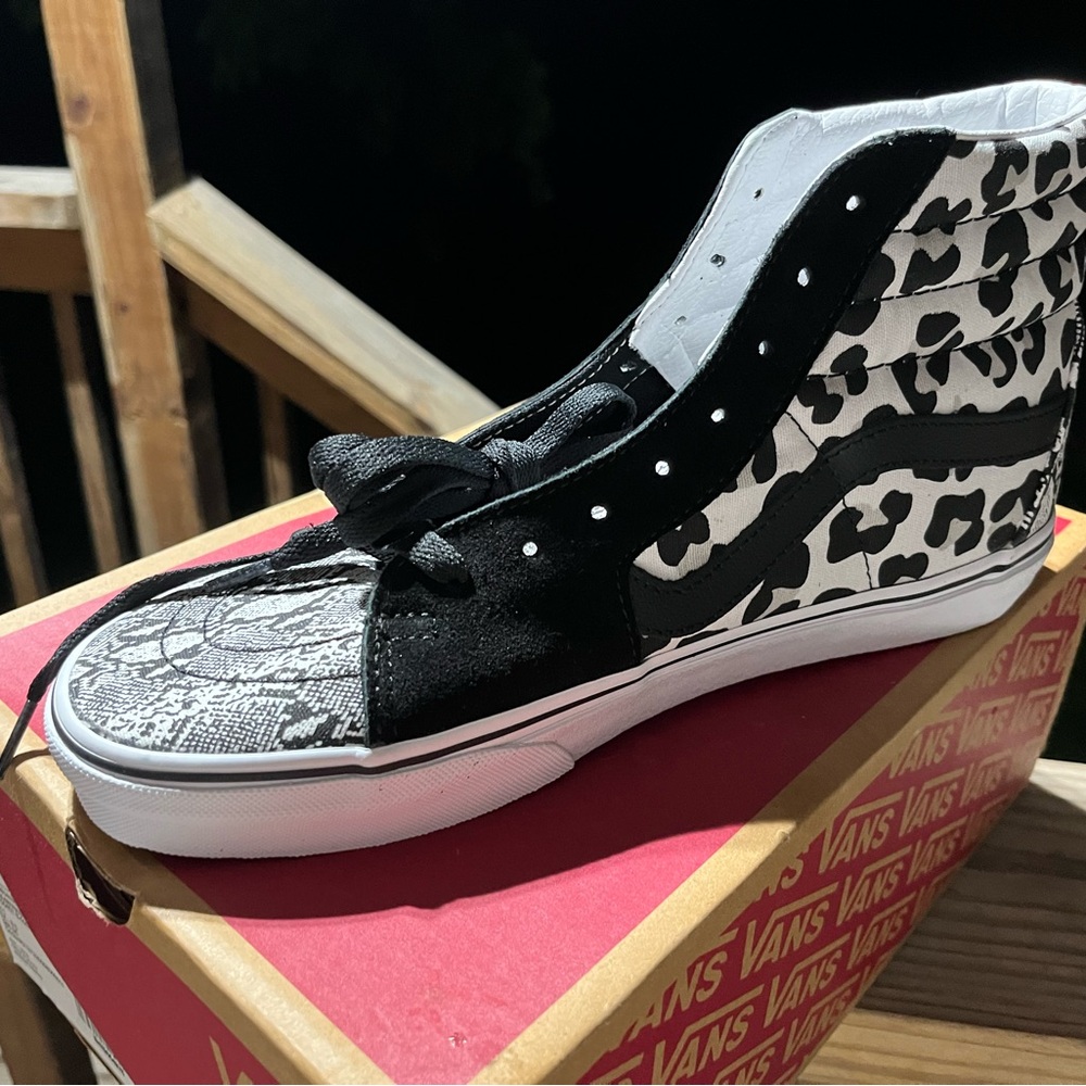 Vans Women's Black and White High-Top Sneakers